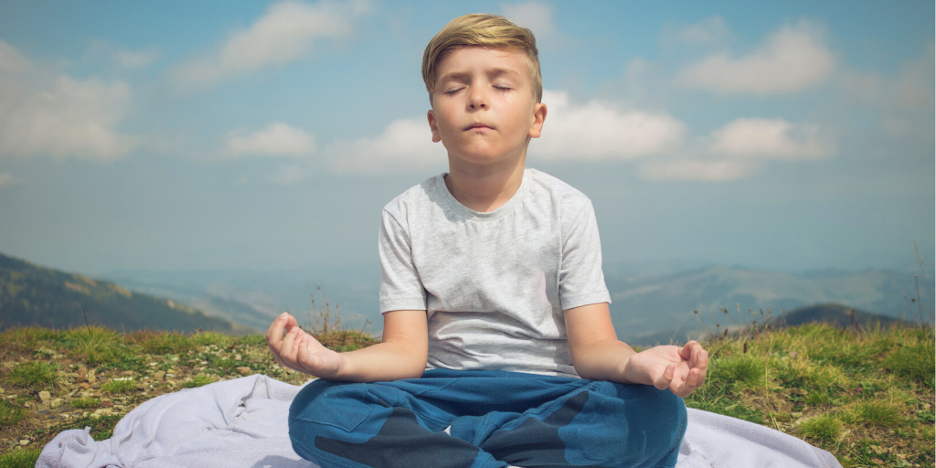 https://www.mightier.com/wp-content/uploads/2022/09/boy-meditating-on-mountain.webp